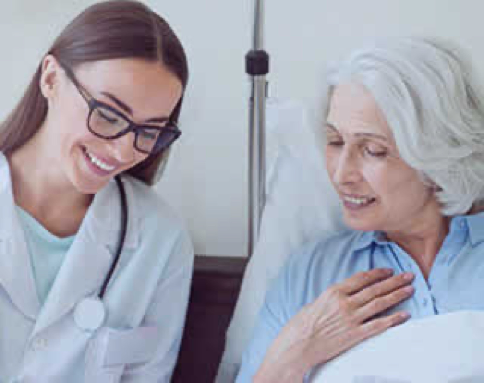 A doctor with a patient on a ward round